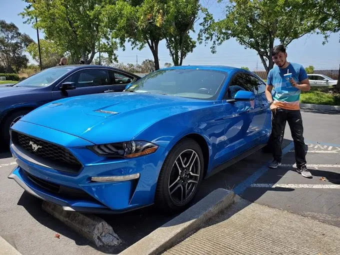 Blue Mustang with tinted windows at Jet Black Tint