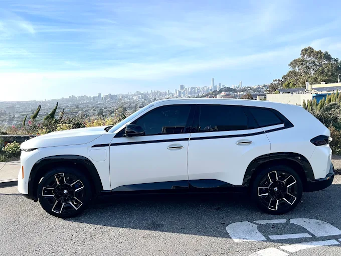 White SUV with tinted side windows at Jet Black Tint